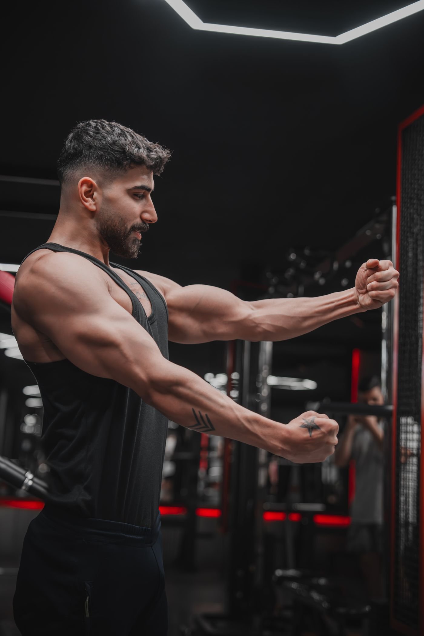 Man performing a controlled strength exercise in a gym