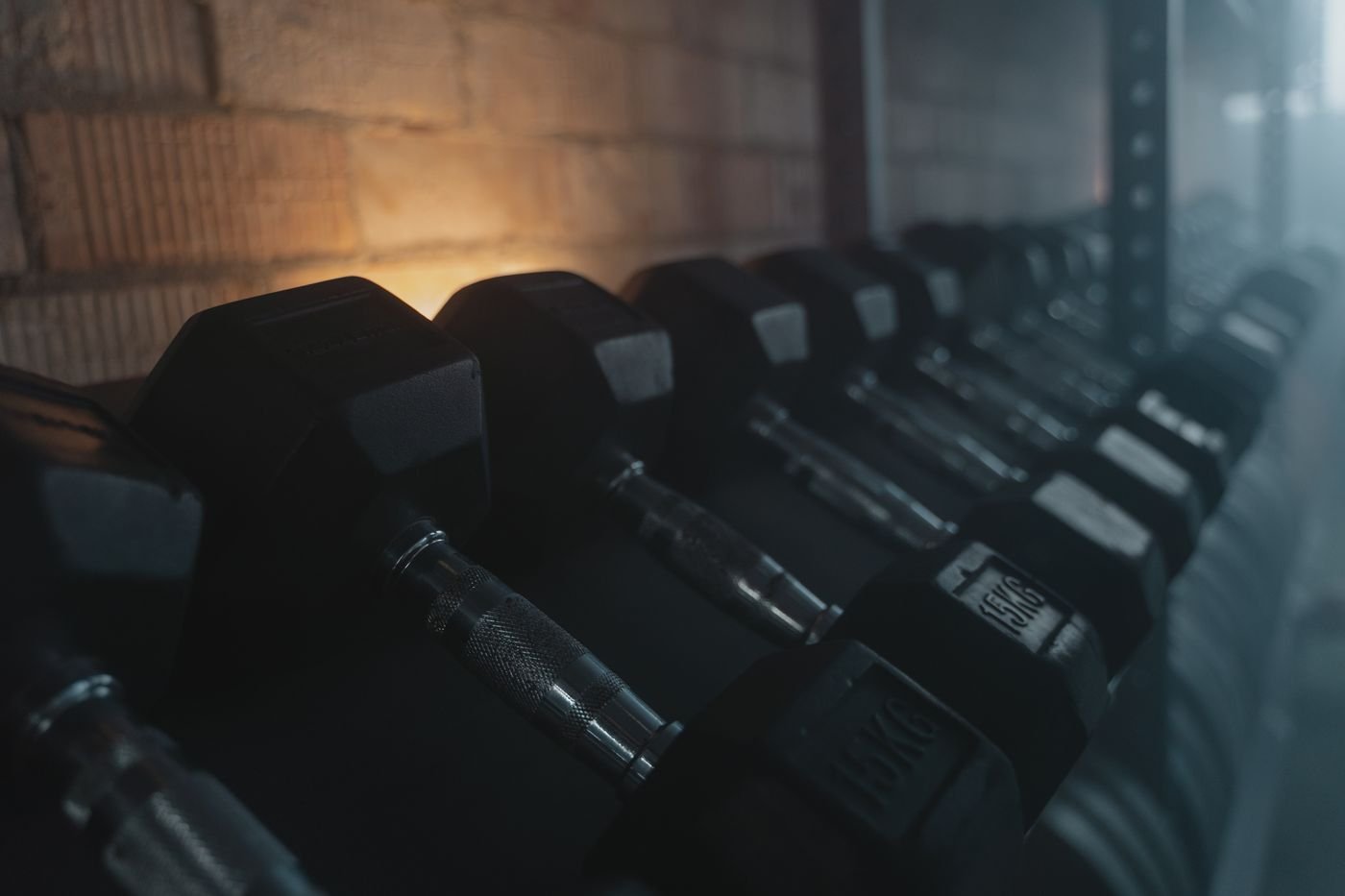 Dumbbells arranged on a rack ready for structured sets