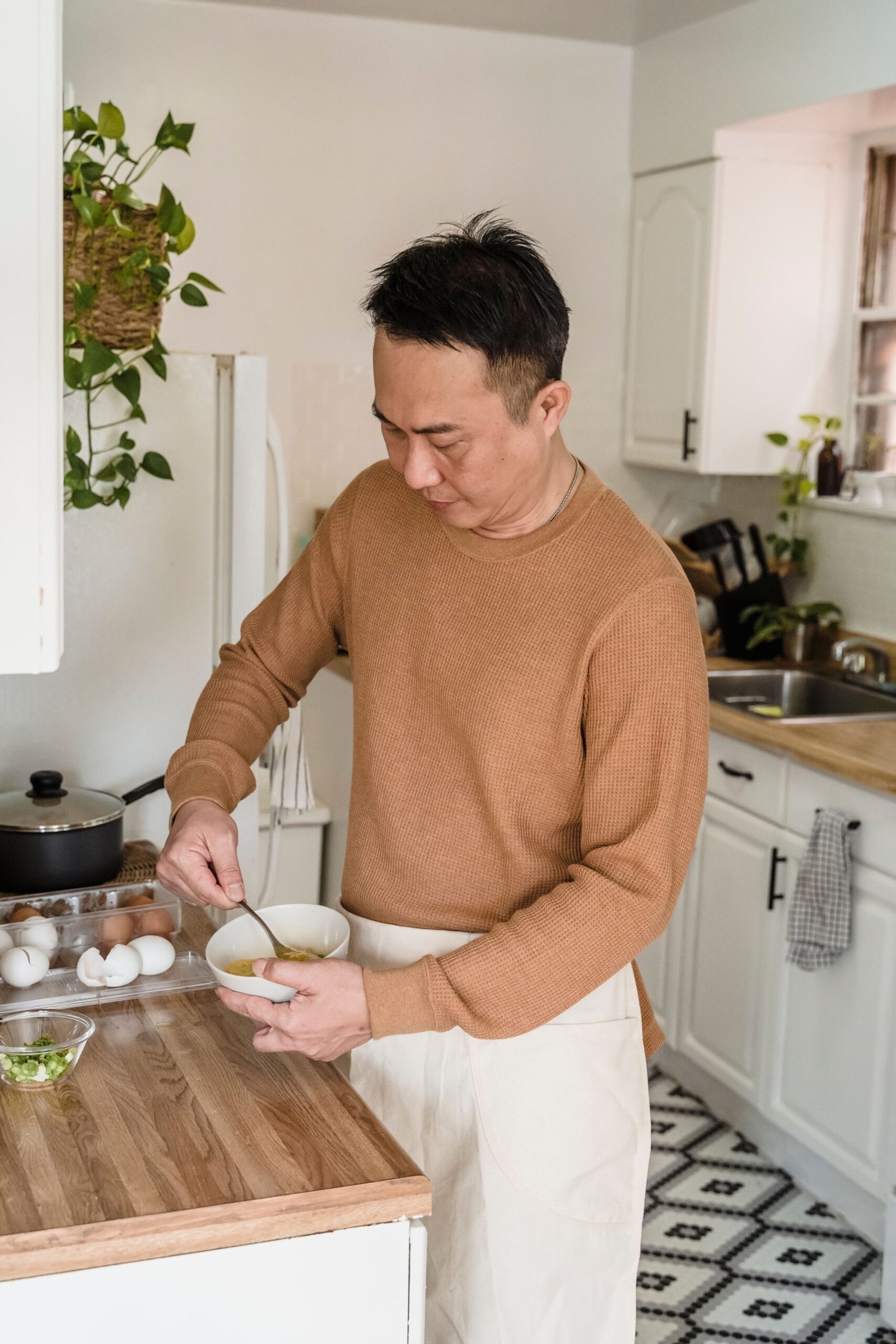 Man preparing food in a home kitchen