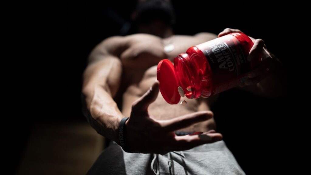 Athlete preparing a protein supplement alongside strength training