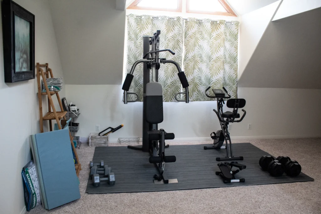 Compact home training space with a multi-gym machine and free weights