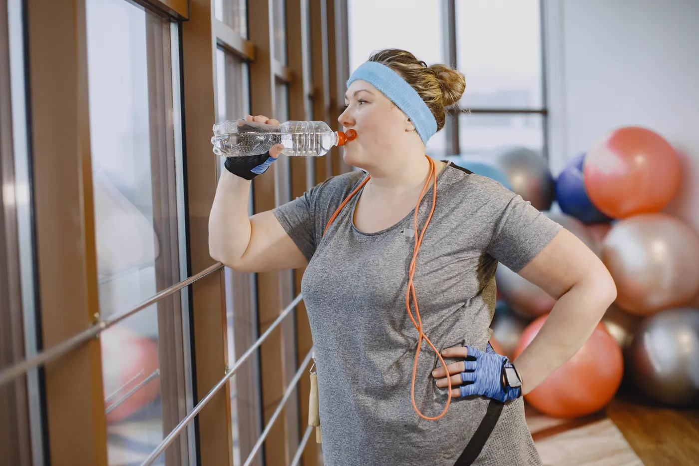 Woman taking a water break during training
