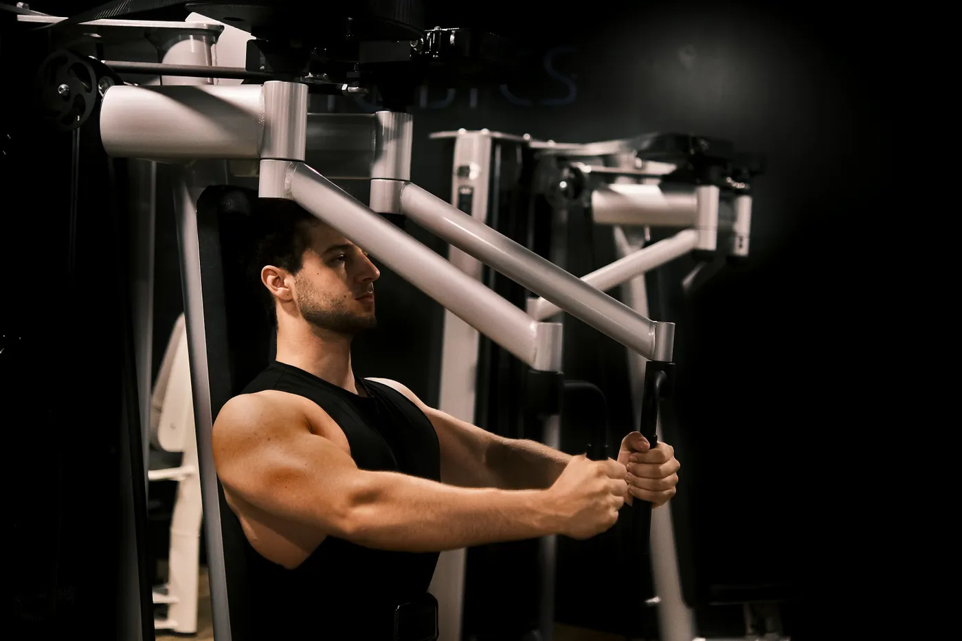 Athlete training on a resistance machine