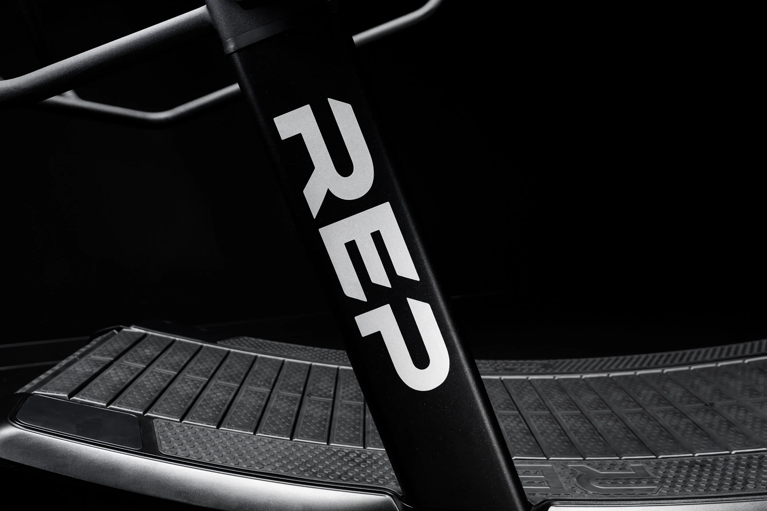 Close-up of the REP Strive curved running belt and frame