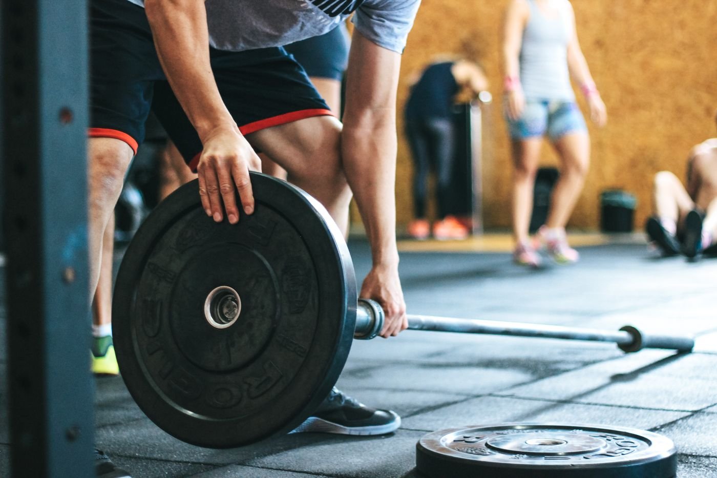 Athlete setting up a barbell for a training session