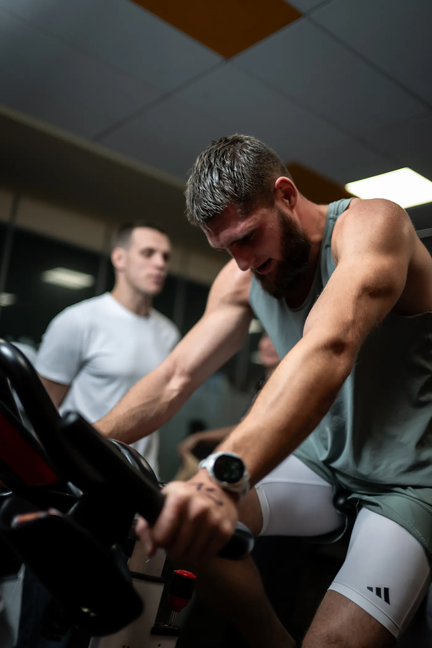 Athletes performing an intense indoor cycling workout together
