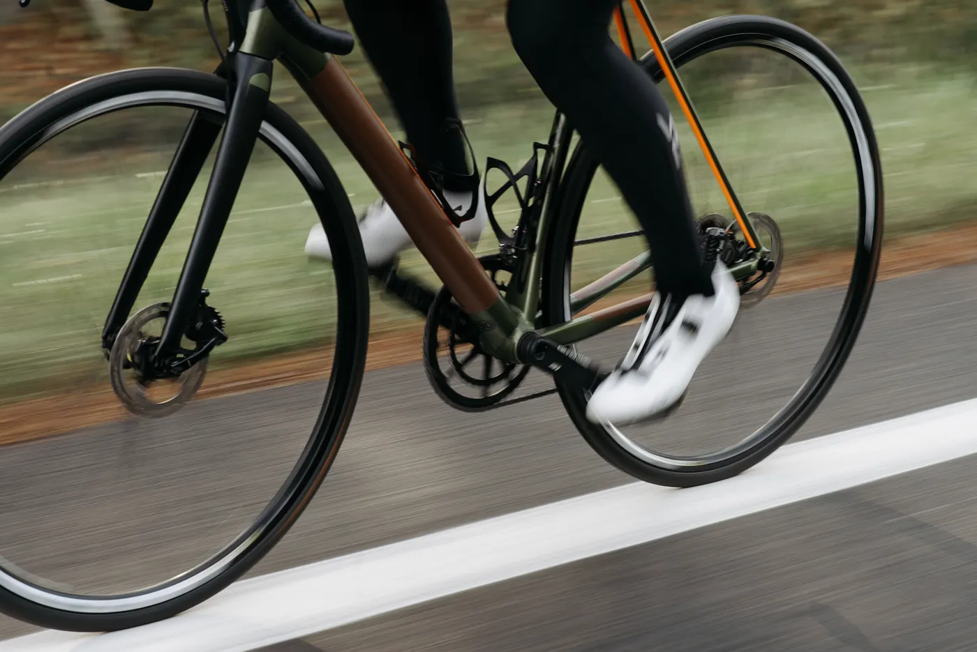 Motion-blurred cyclist illustrating a fast effort