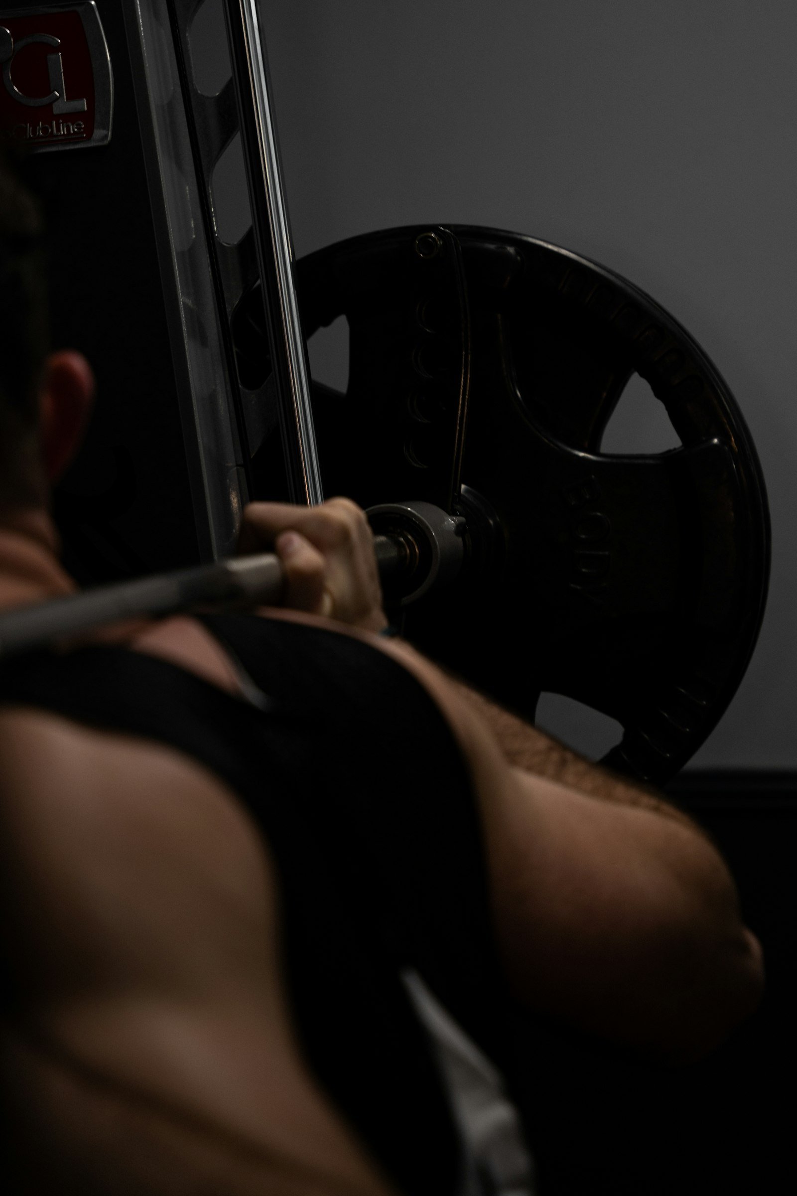 Lifter performing a barbell squat between demanding sets