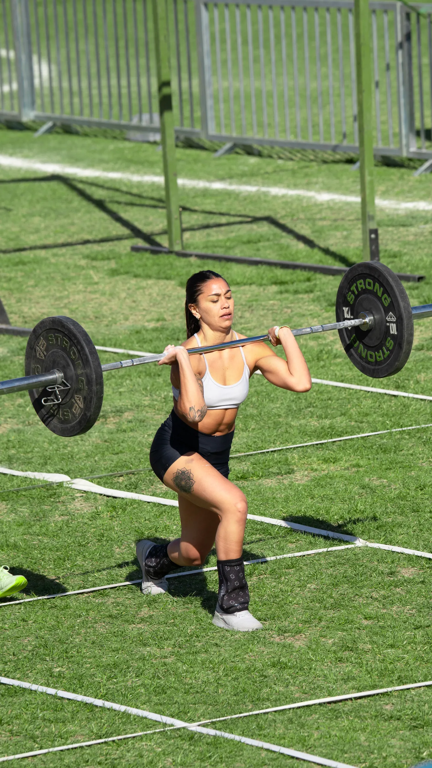 Athlete performing a weighted barbell lunge