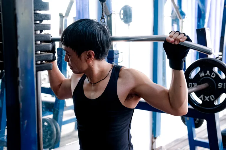 Athlete performing a barbell squat during a strength workout