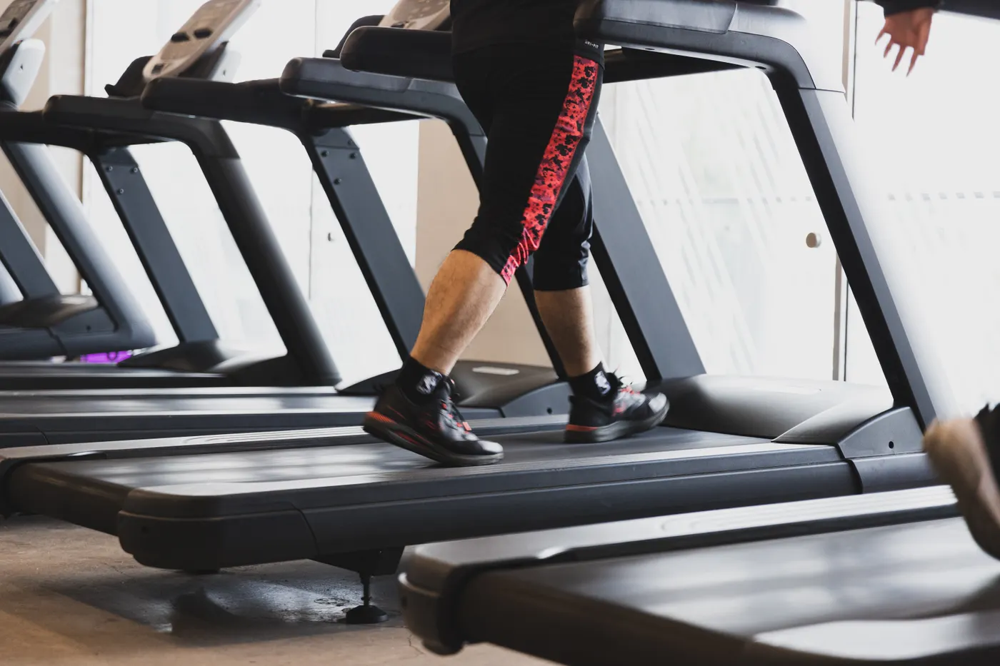 Person walking on a treadmill for moderate aerobic exercise