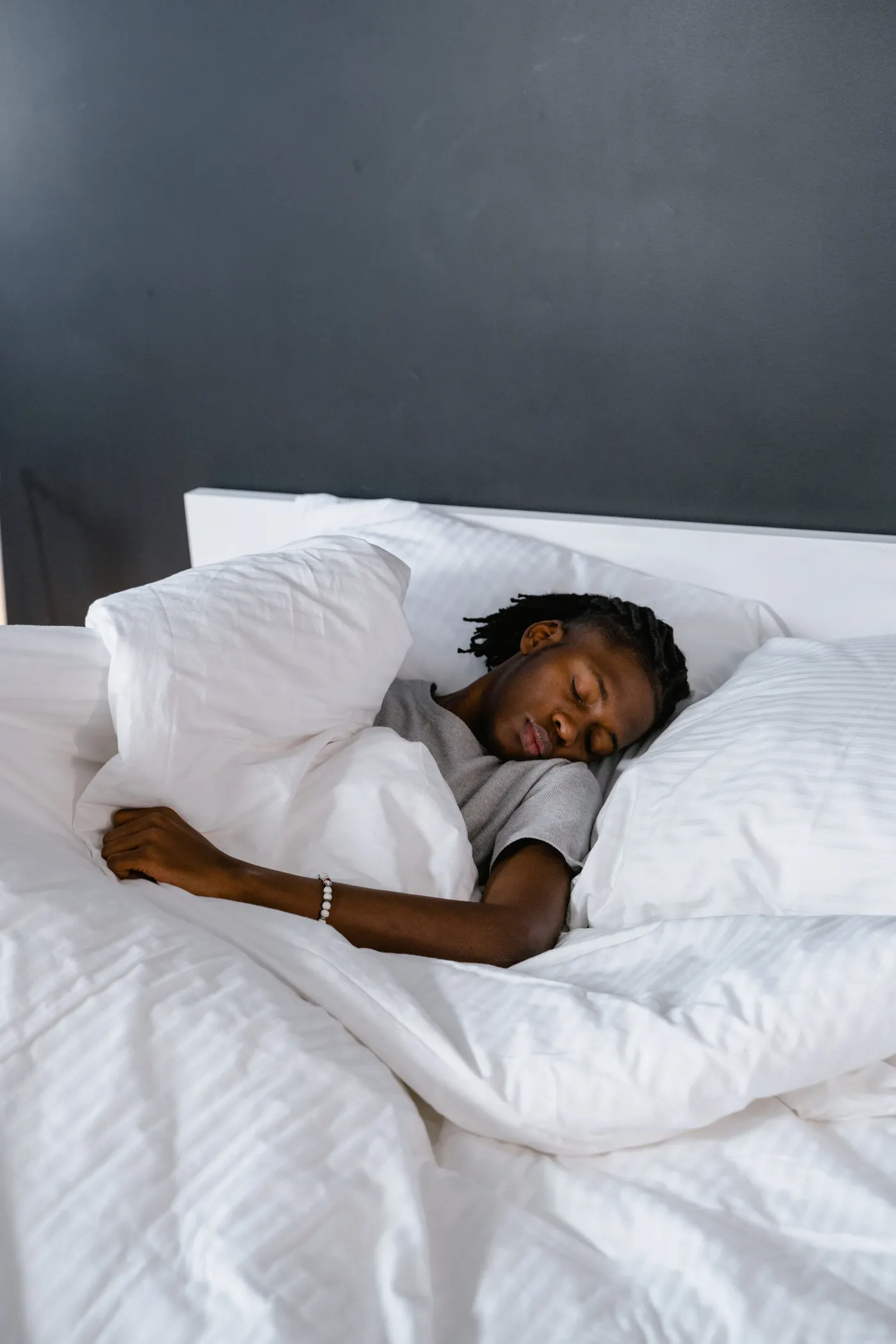 Person sleeping peacefully in bed