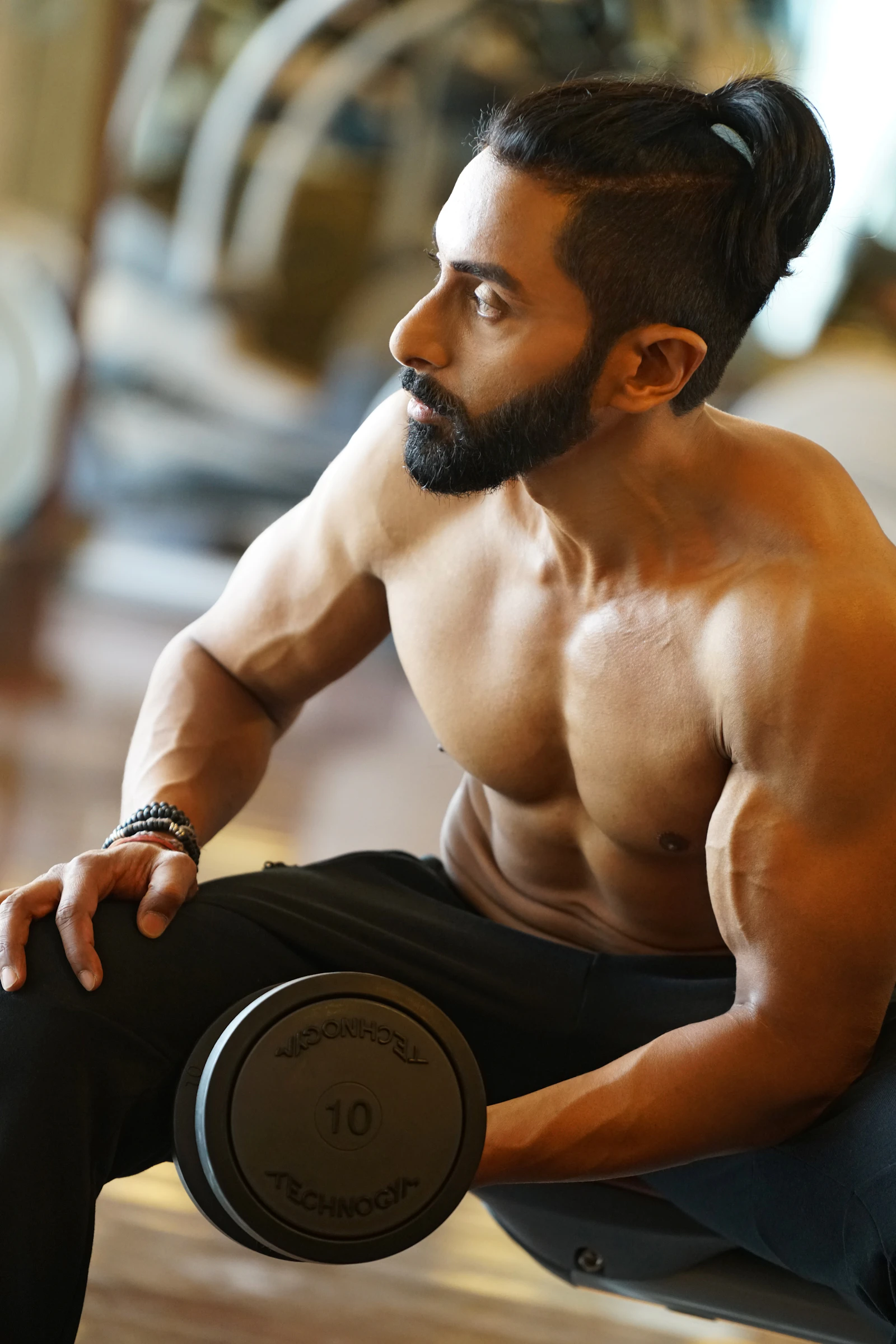 Athlete holding a dumbbell while preparing for strength exercise
