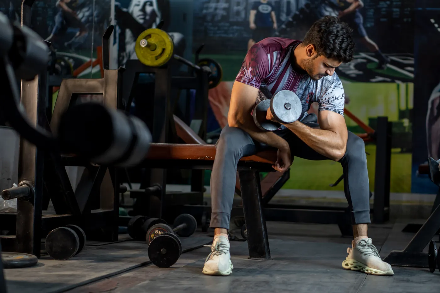 Athlete training with a dumbbell during a gym workout