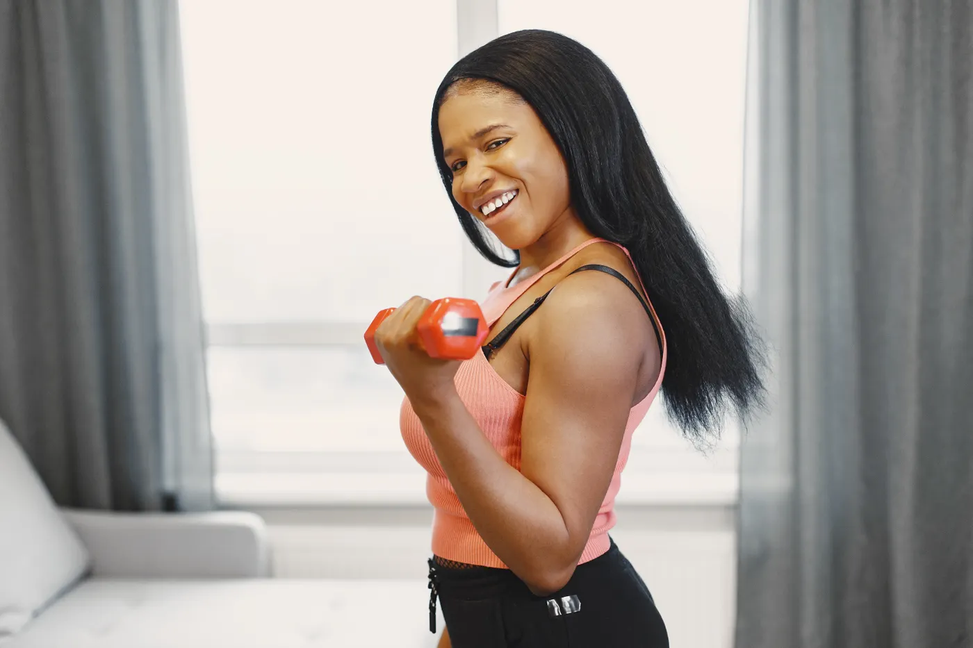Woman lifting a dumbbell during a strength workout