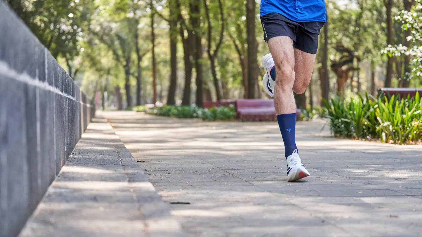 Person jogging along a park path