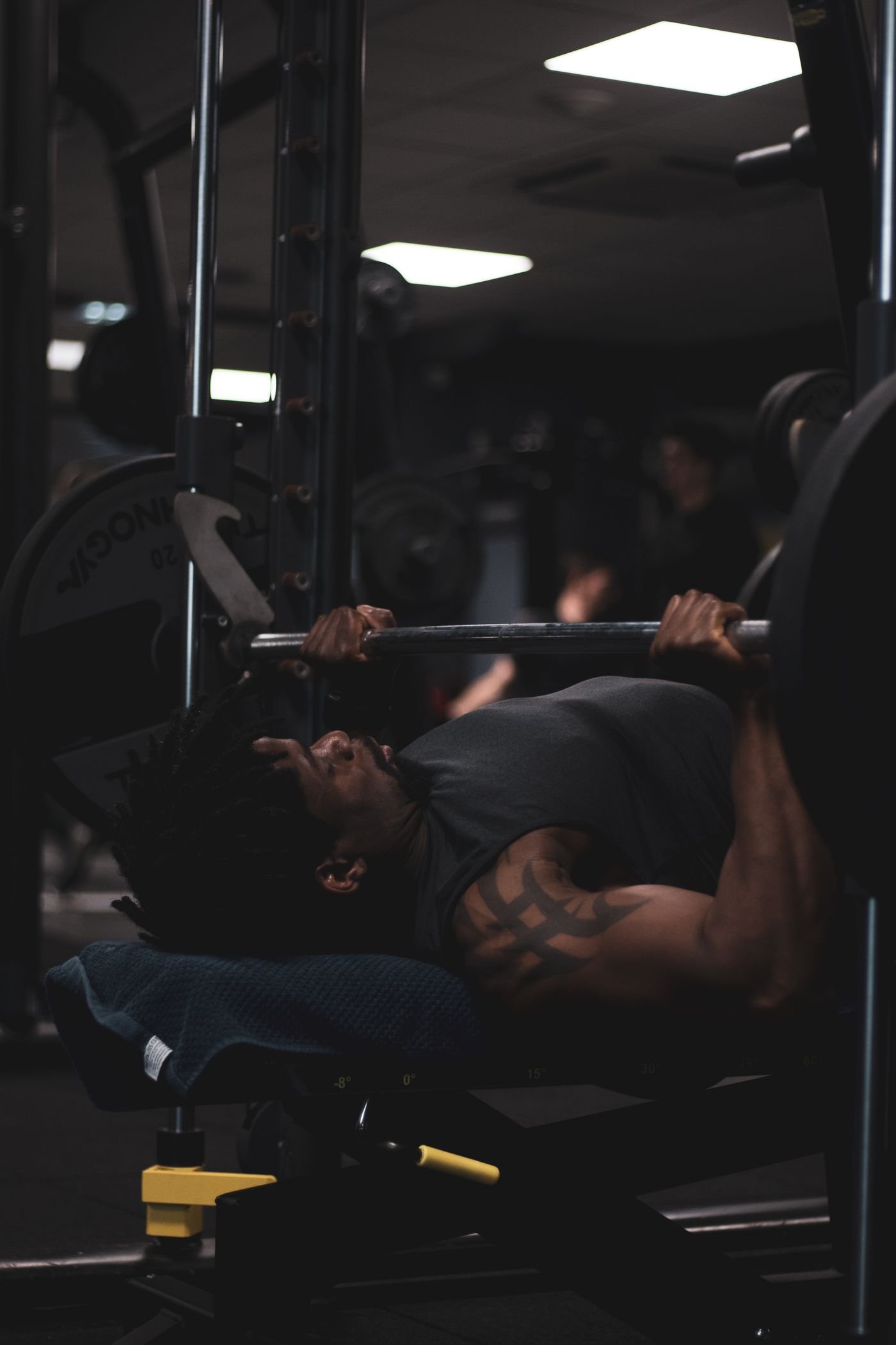 Lifter performing a bench press with a barbell
