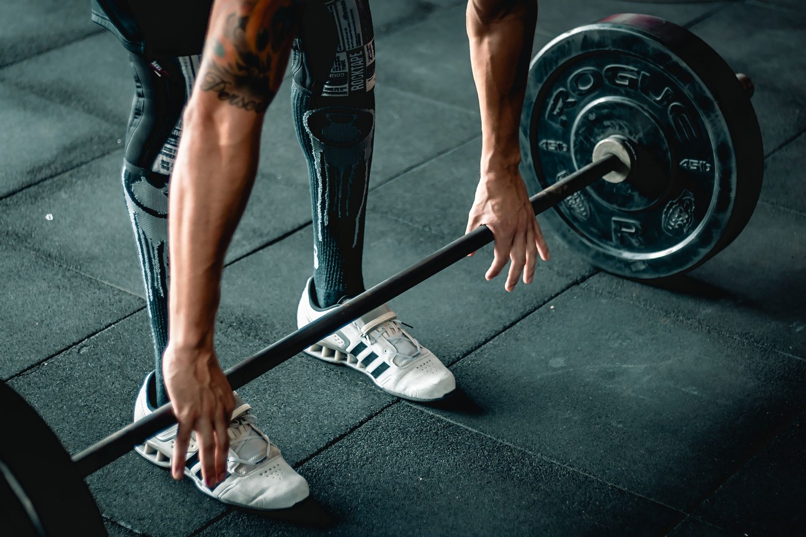 Lifter preparing a loaded barbell pull