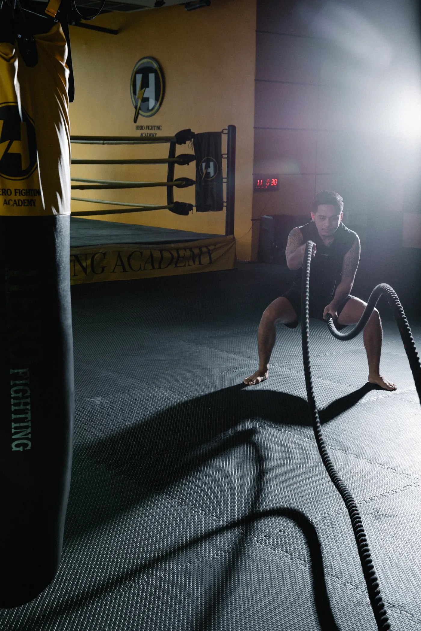 Athlete using battle ropes during a conditioning workout