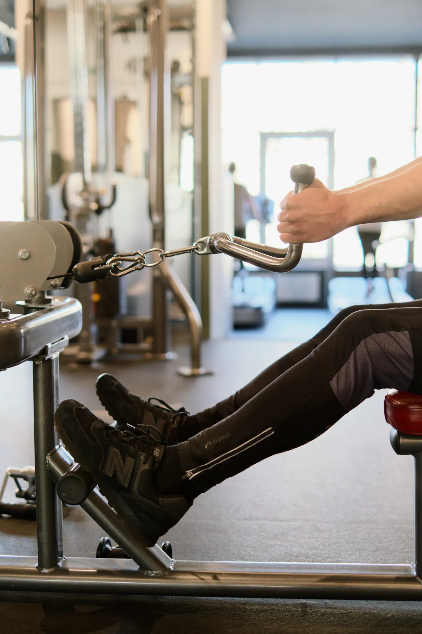 Athlete using an indoor rowing machine for cardio training