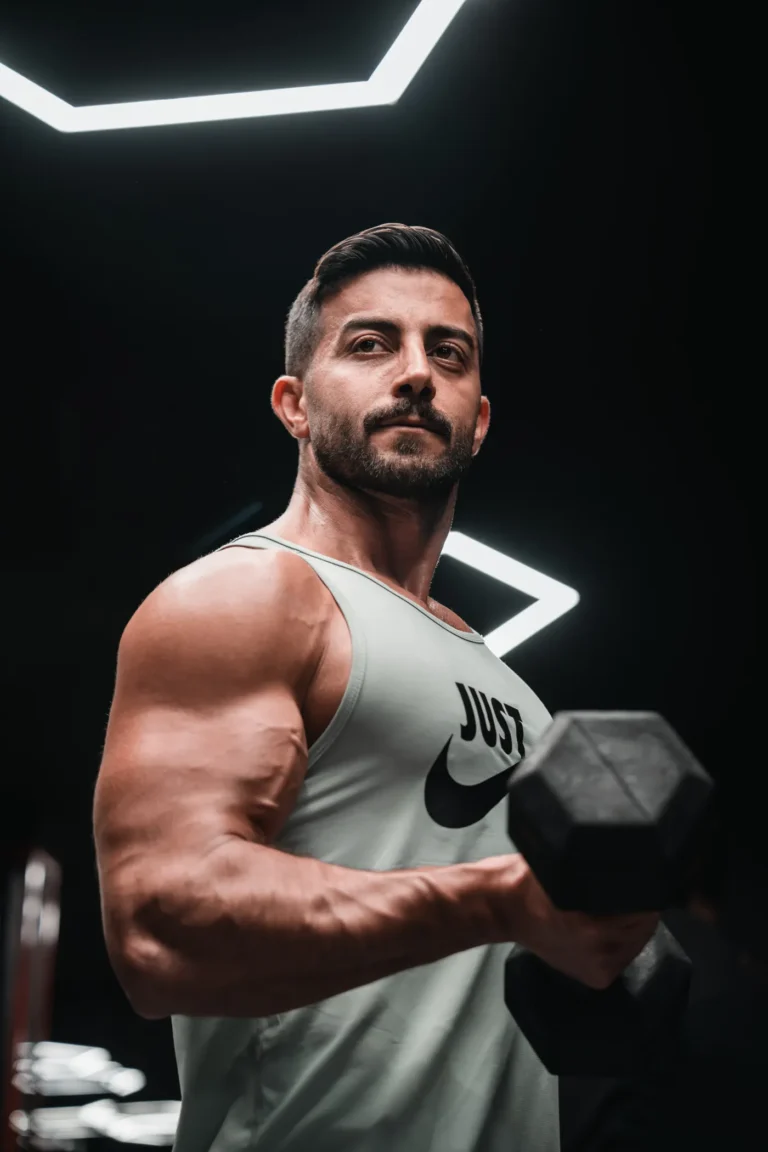 Man lifting a dumbbell during strength training in a gym