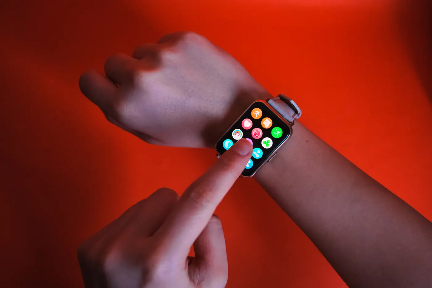 Person checking a smartwatch, illustrating exercise timing and activity tracking