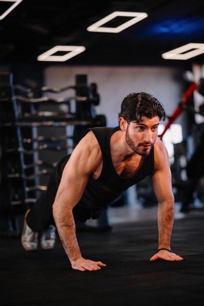 Athlete performing a controlled push-up on a gym floor