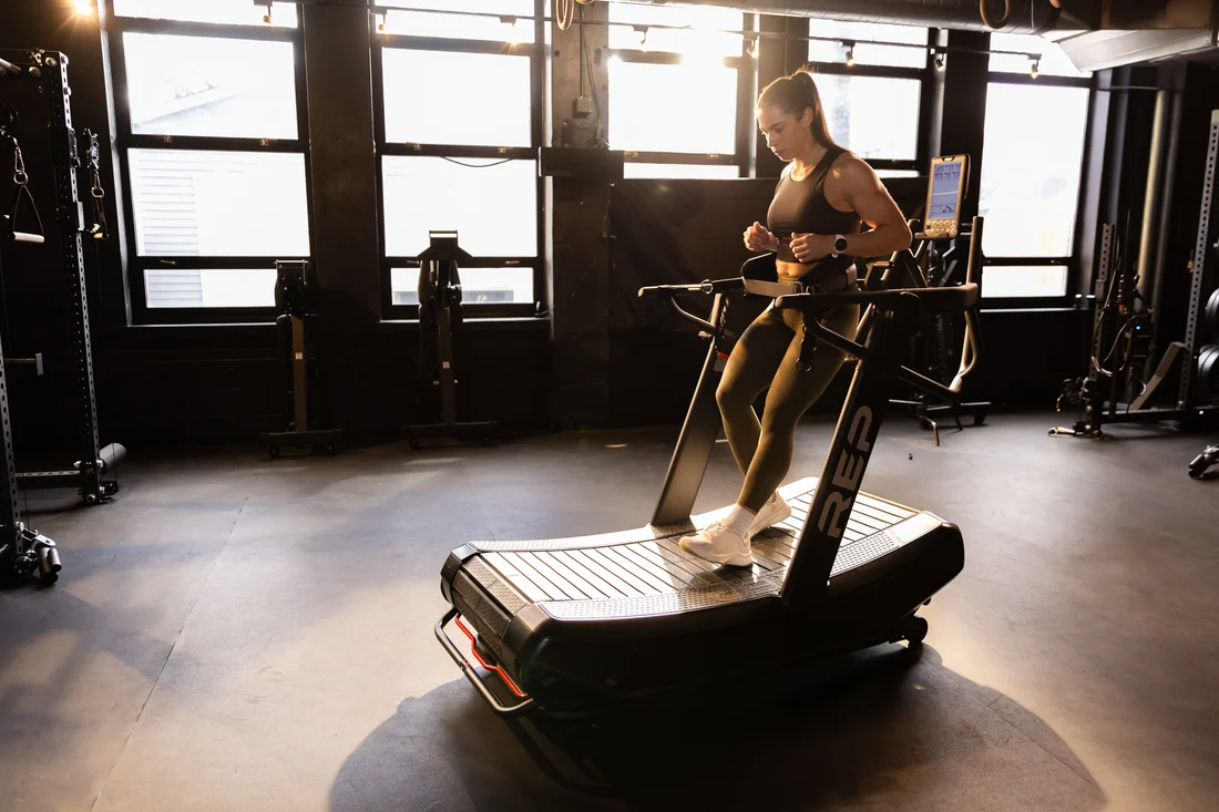 Athlete walking backward on the REP Strive treadmill