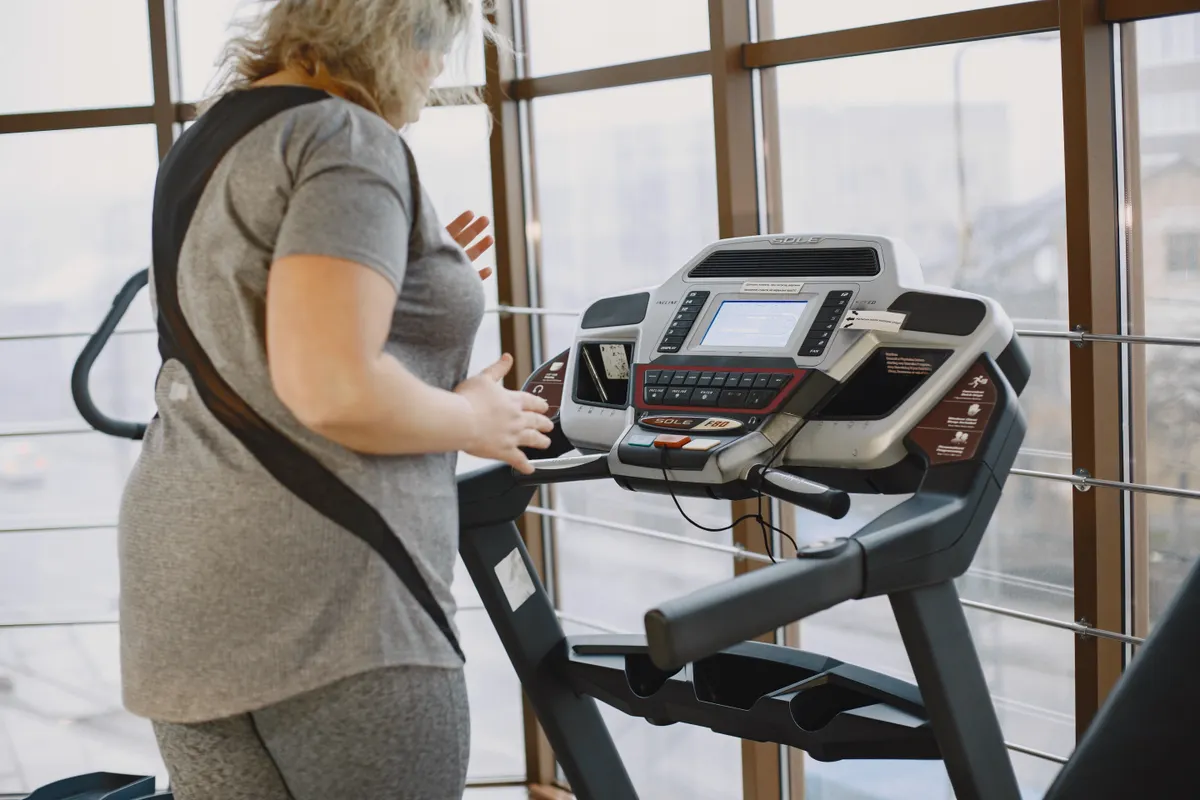Woman using a treadmill for cardio training