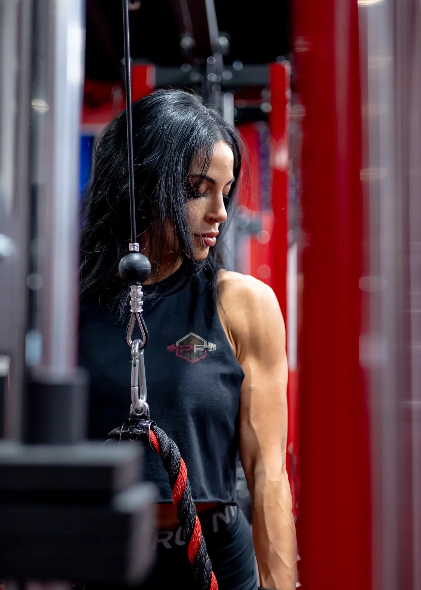 Woman training with a cable machine