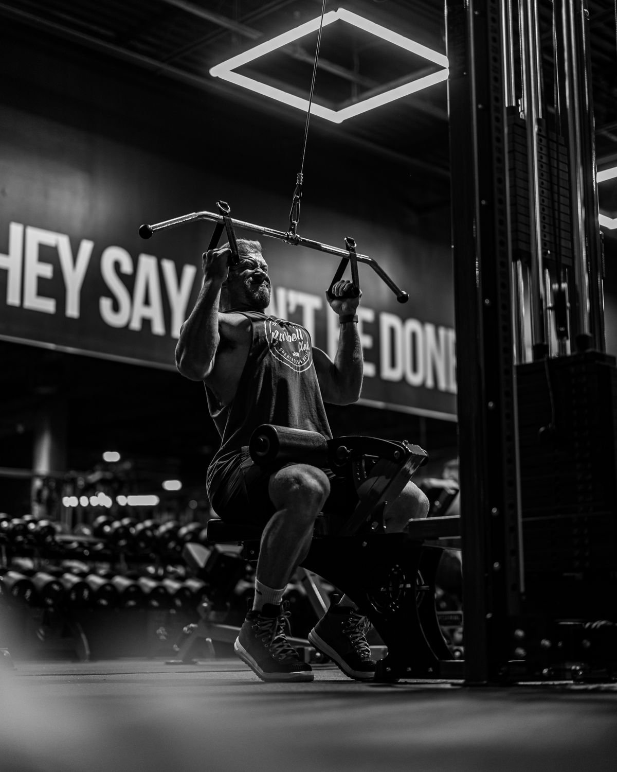Man using a lat pulldown and low row cable station