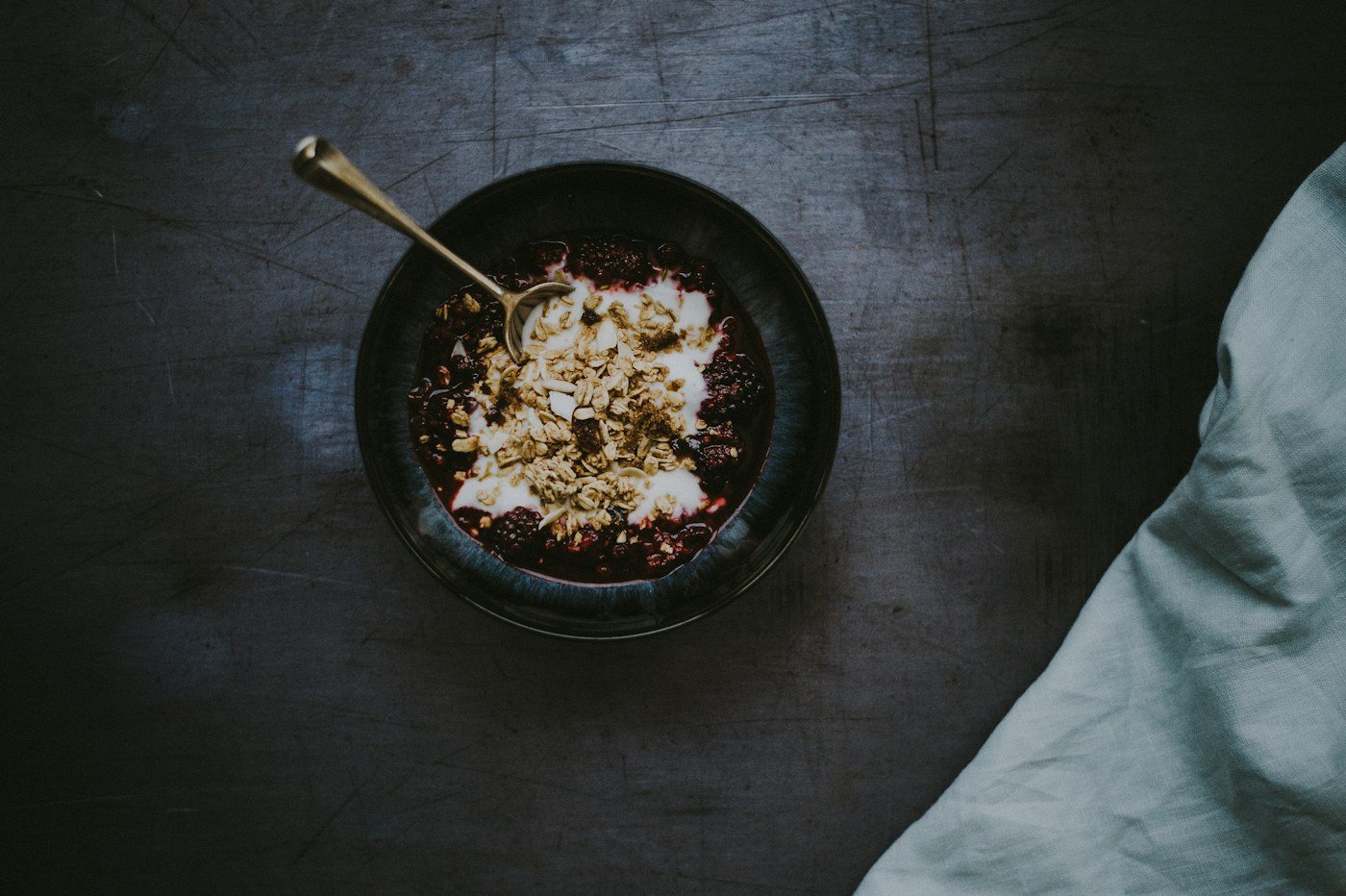 Yogurt with berries and granola in a bowl