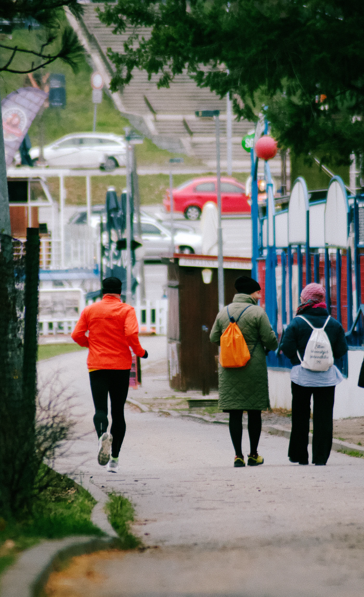 People walking and jogging along an outdoor exercise path