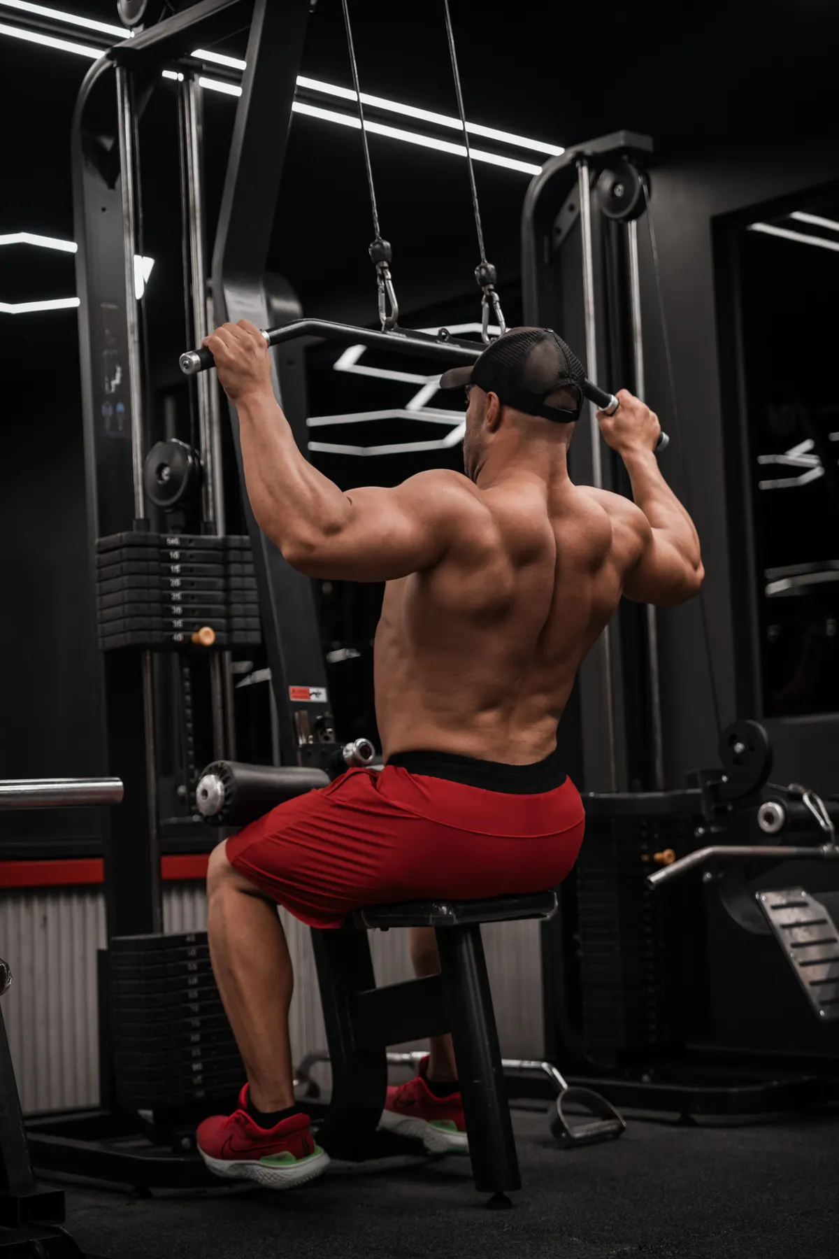 Lifter using a lat pulldown machine for back strength