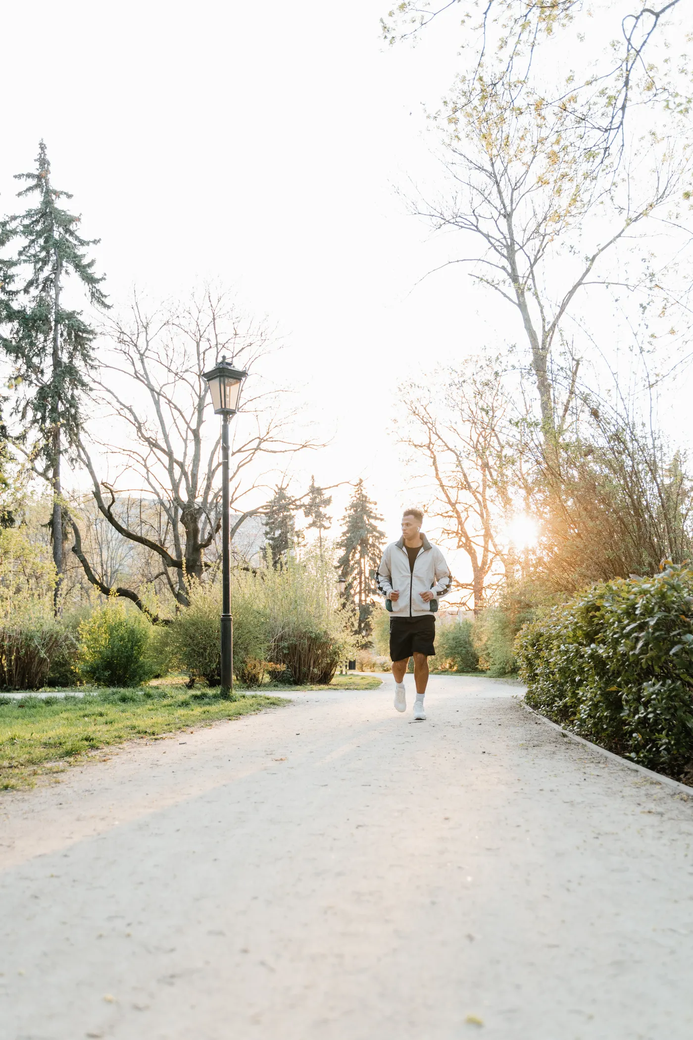 Runner jogging along a park path during an easy run