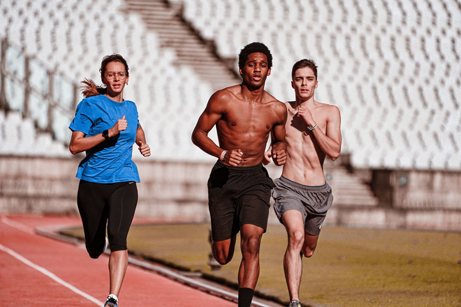 Athletes running on an outdoor track