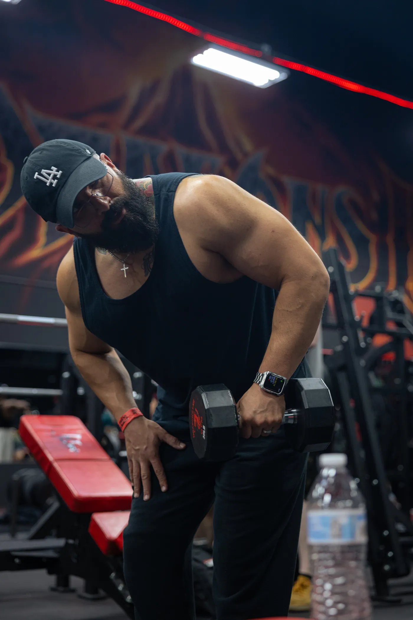 Man training with a dumbbell in a gym