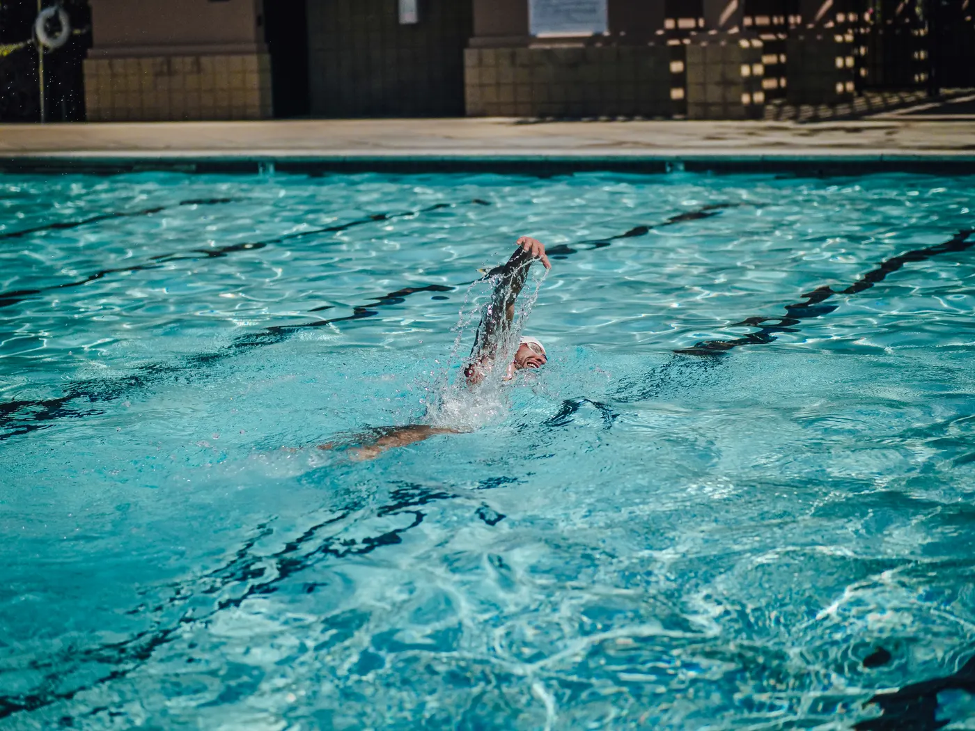 Swimmer practicing freestyle in a pool