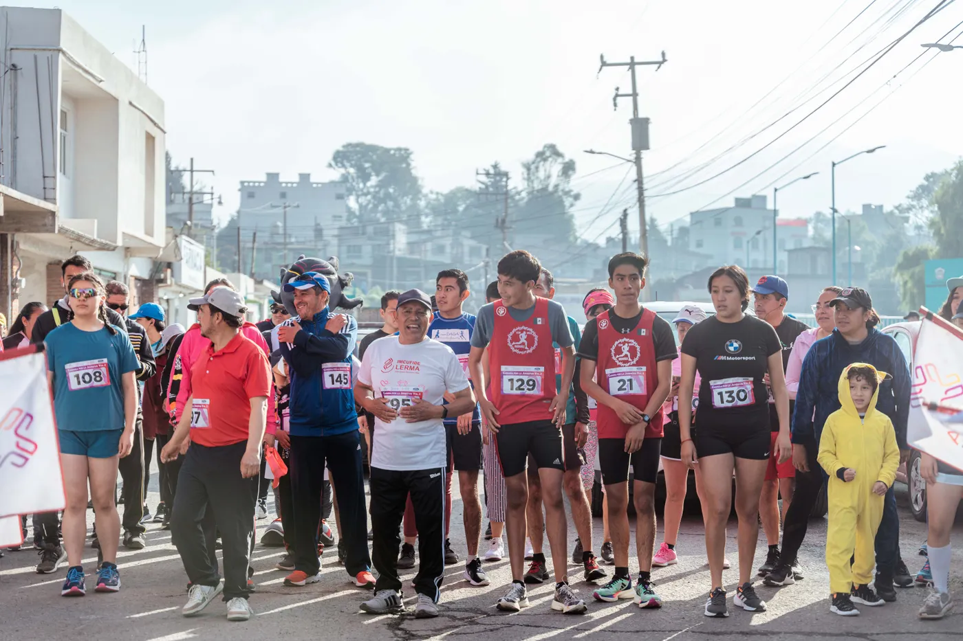 Runners gathering at the start of an outdoor marathon
