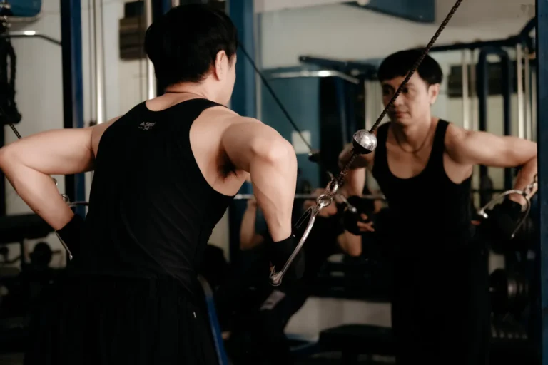 Athlete performing cable resistance training in a gym