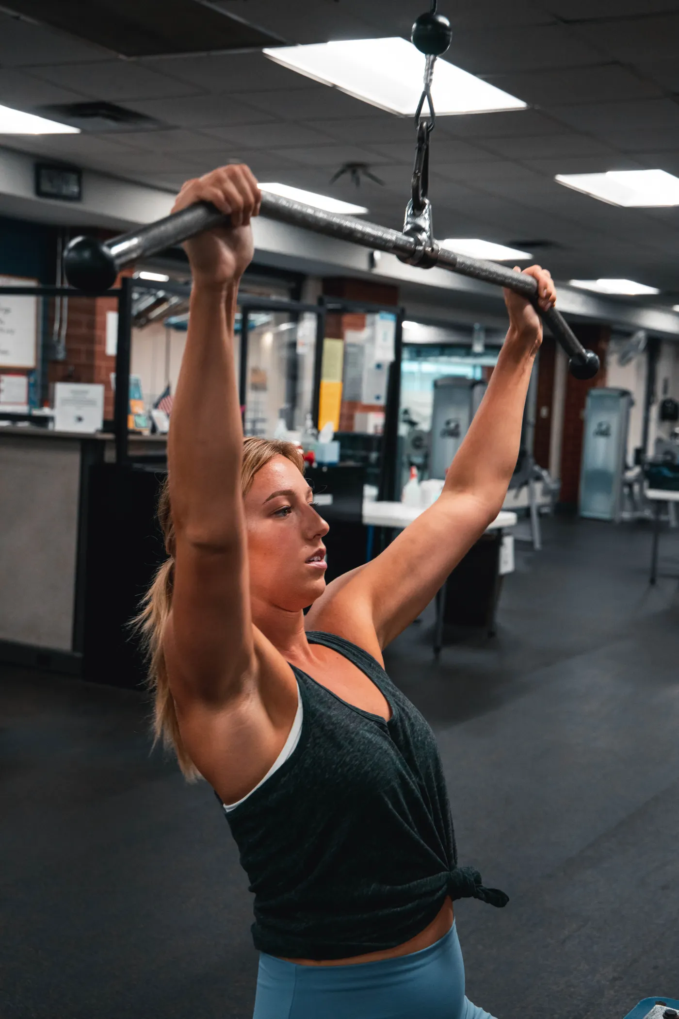Woman training on a resistance machine at a gym