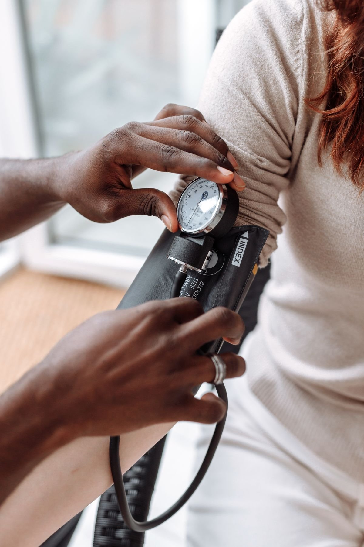 Healthcare professional checking a patient's blood pressure
