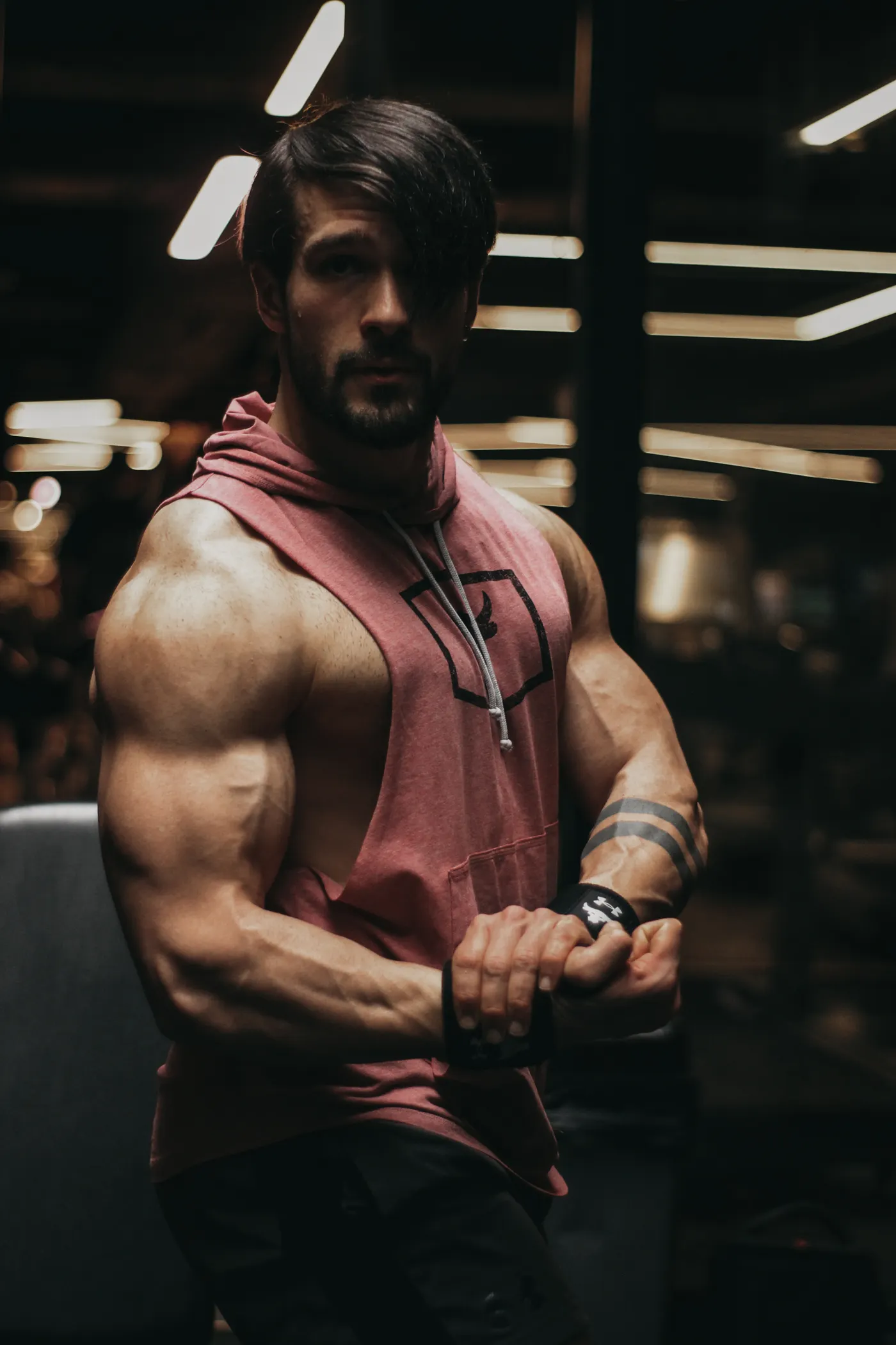 Athlete wearing a sleeveless hoodie in a gym