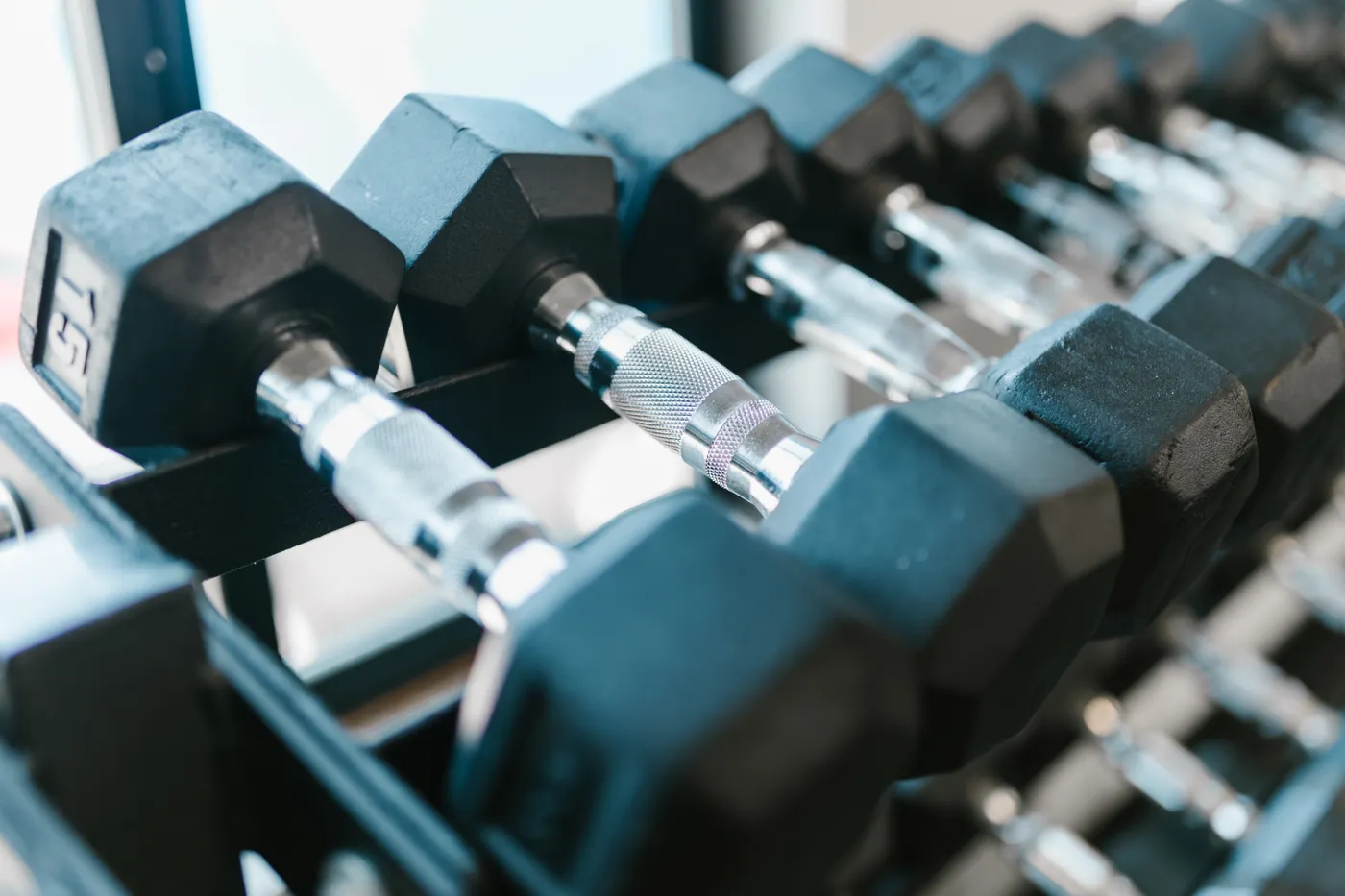 Rows of dumbbells offering incremental training loads
