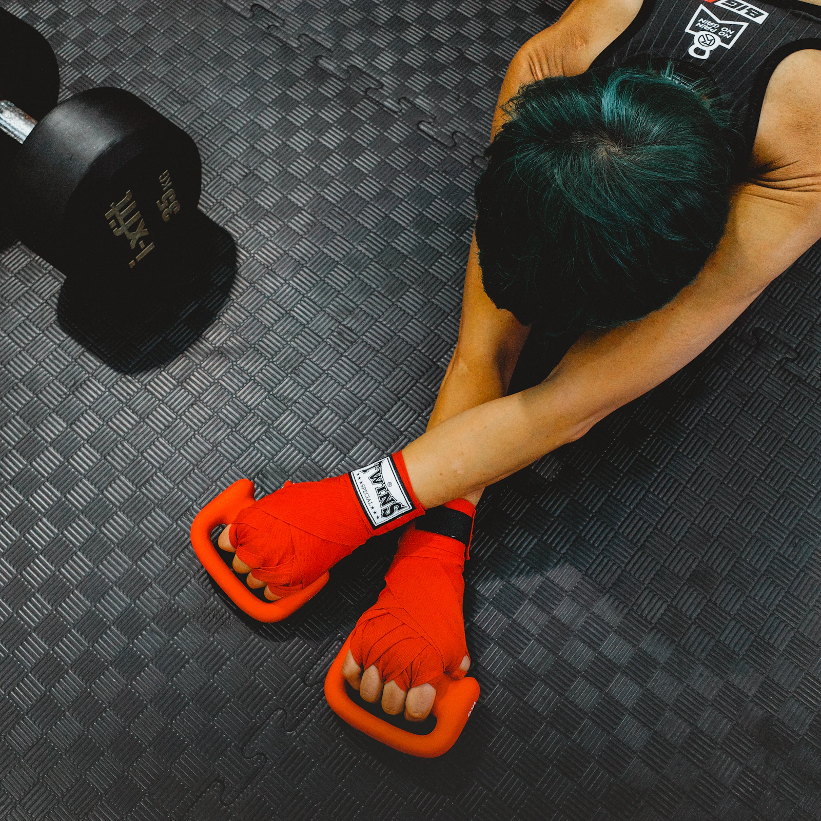 Athlete stretching on a gym floor