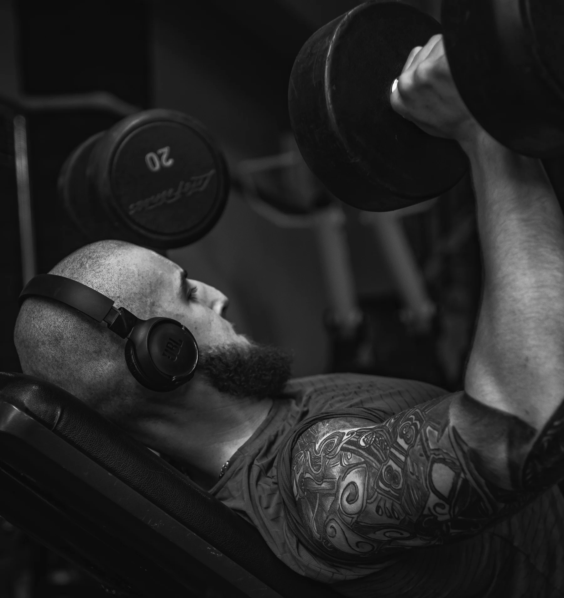 Athlete performing an incline dumbbell press