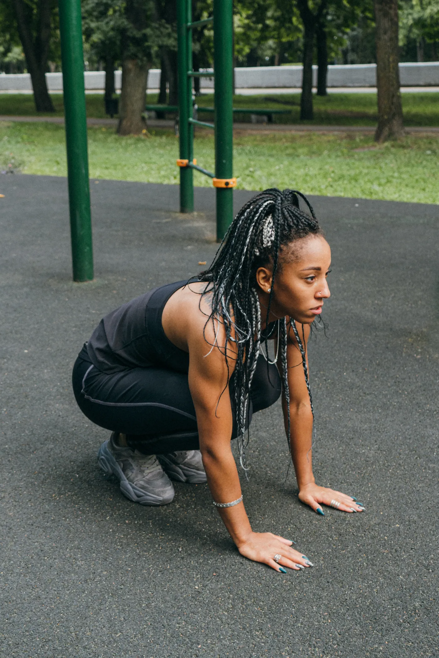 Woman performing a bodyweight squat outdoors