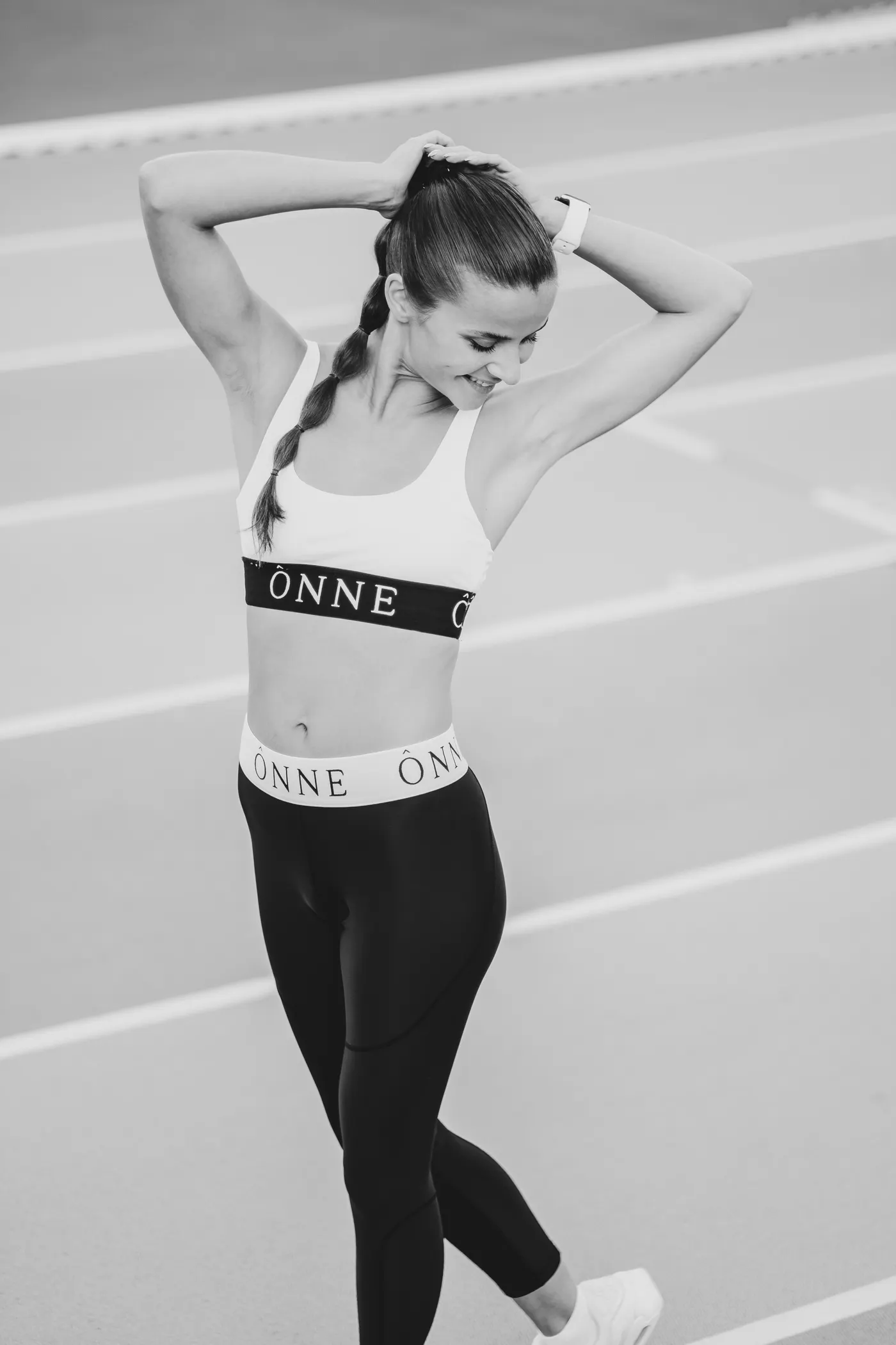 Runner stretching after a track session