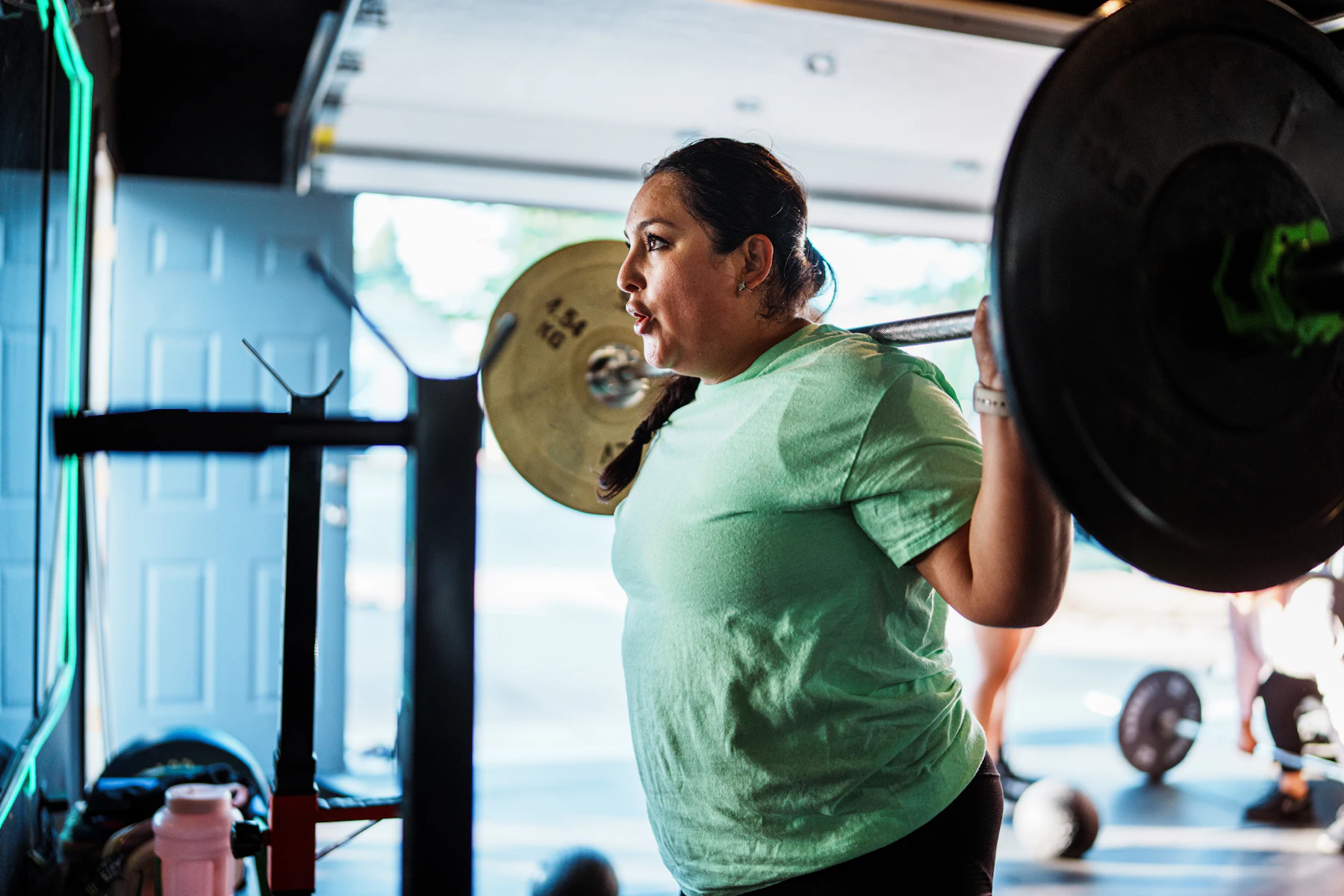 Woman lifting weights during a strength-training session