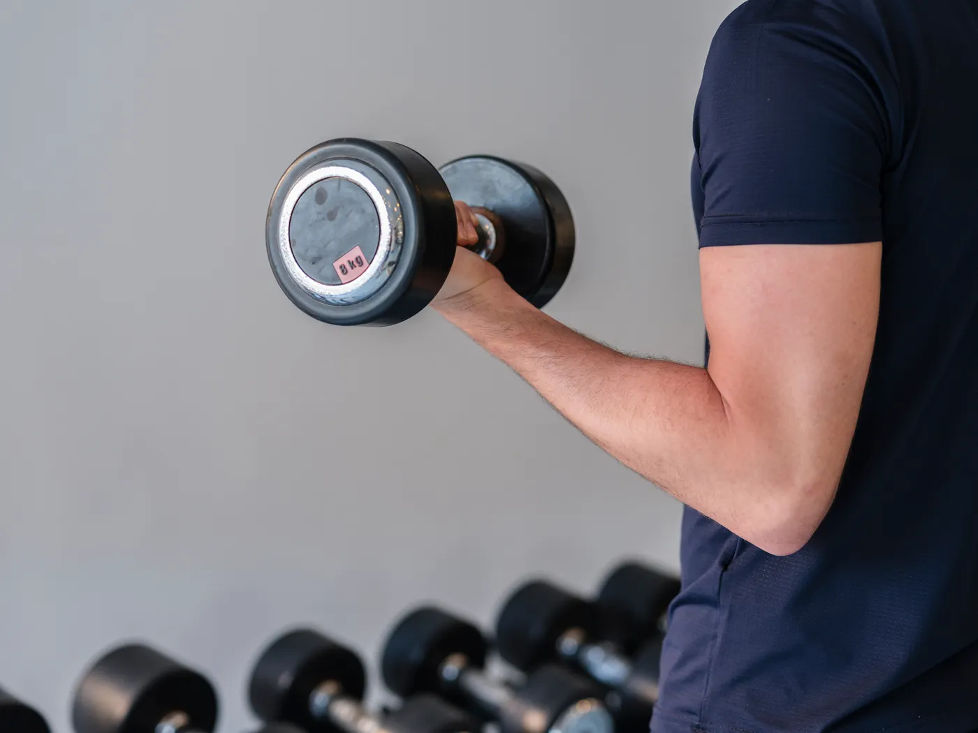 Athlete holding a dumbbell during strength training